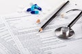 Medical pills and stethoscope Royalty Free Stock Photo