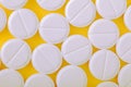 Medical pills on yellow baclground Royalty Free Stock Photo