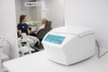 medical plasma centrifuge for the plasmolifting procedure in a dental clinic. against the background of a doctor and a