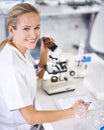 Medical, portrait and research with tablet and microscope in lab with development in biotechnology. Scientist, writing