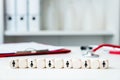 Medical practice with wooden blocks and symbols for men and women