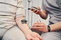 Male physiotherapist measuring muscle activity with testing unit Royalty Free Stock Photo