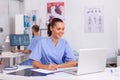 Medical practitioner sitting at desk Royalty Free Stock Photo