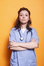 Nurse with arms crossed looks at camera Royalty Free Stock Photo