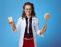 Medical practitioner woman showing soap bar and bath brush
