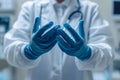 Medical precision Close up of doctor wearing latex gloves for examination