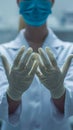 Medical precision Close up of doctor wearing latex gloves for examination