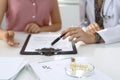 Medical prescription form, capsules and pills are lying against the background of a doctor and patient discussing health Royalty Free Stock Photo