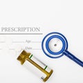 Medical prescription and pills with stethoscope on table - close up Royalty Free Stock Photo