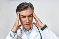 Medical problems. Close up portrait of worried male doctor in medical uniform with stethoscope around neck feeling upset Royalty Free Stock Photo