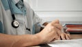 Medical professional doctor writing RX prescription on clipboard. Royalty Free Stock Photo