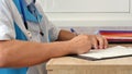 Medical professional doctor writing RX prescription on clipboard. Royalty Free Stock Photo