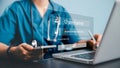 Medical professional using laptop, smartphone with virtual login interface highlighting secure access, healthcare technology data Royalty Free Stock Photo