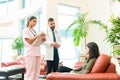 Medical Professionals Communicating With Woman At Hospital Royalty Free Stock Photo