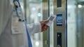 A medical professionals hand using a card with a QR code to quickly access a patients records on the system Royalty Free Stock Photo