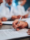 Medical Professionals Signing Important Documents in a Collaborative Meeting Setting With Focus on Details of the Royalty Free Stock Photo