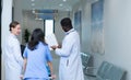 Medical professor and intern looking at an MRI of a patient who received a concussion to the head after an accident