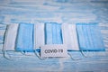 Medical protective masks on a blue wooden surface. Cavid-19 coronavirus infections