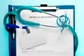 Medical questionnaire with stethoscope and ID tag Royalty Free Stock Photo