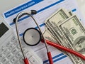 Medical reimbursement with health insurance claim form and stethoscope with money dollars Royalty Free Stock Photo