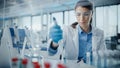 Medical Research Laboratory: Portrait of a Beautiful Female Scientist in Goggles Using Micro Pipet Royalty Free Stock Photo