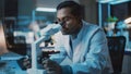 Medical Research Scientist Conducts DNA Experiments Under a Digital Microscope in a Biological App Royalty Free Stock Photo