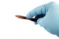 medical scalpel in the hand of a surgeon