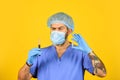 Medical scientist hold test tubes. doctor wearing surgical mask while testing. nurse examines blood samples in lab. what