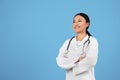 Medical Services. Confident Asian Doctor Woman In Uniform Standing With Folded Arms Royalty Free Stock Photo