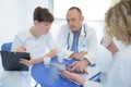 Medical staff chatting in modern hospital canteen Royalty Free Stock Photo