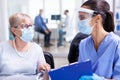 Medical staff with disabled woman Royalty Free Stock Photo