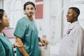 Medical staff having a conversation in the hallway