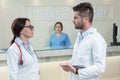 Medical Staff Having Discussion In Modern Hospital Corridor Royalty Free Stock Photo