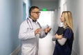 Medical Staff Having Discussion In Modern Hospital Corridor Royalty Free Stock Photo
