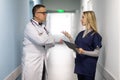 Medical Staff Having Discussion In Modern Hospital Corridor Royalty Free Stock Photo