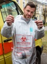 Medical staff of Latvian State Emergency Medical Service shows Bio Hazard Bag for transporting Corona Virus tests