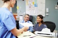 Medical Staff Meeting At Nurses Station Royalty Free Stock Photo