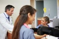 Medical Staff Meeting At Nurses Station Royalty Free Stock Photo