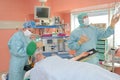 medical staff preparing for operation on woman in theatre Royalty Free Stock Photo