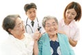 Medical staff with senior women Royalty Free Stock Photo