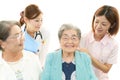 Medical staff with senior women Royalty Free Stock Photo