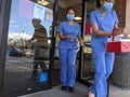 Medical staff transporting blood, organs, or medication in a cooler out of UW Medicine Clinic