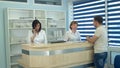 Medical staff working at busy medical reception desk Royalty Free Stock Photo