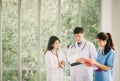 Medical staffs discussing in hospital corridor