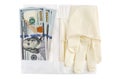 Medical sterile rubber gloves and stack of 100 USD banknotes. Isolated on white Royalty Free Stock Photo