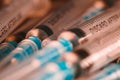 Medical Sterile Syringes Needles, Close up Syringes on wooden Background, Health care concept.