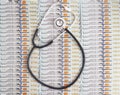 Medical stethoscope on the background of dollar banknotes. Healthcare and medical expenses concept, business Royalty Free Stock Photo