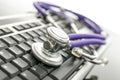 Medical stethoscope on computer keyboard Royalty Free Stock Photo