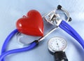 Medical stethoscope head and red toy heart lying on cardiogram chart closeup. help, prophylaxis, disease prevention or insurance Royalty Free Stock Photo