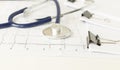 Medical stethoscope lying on cardiogram chart closeup. Medical help, prophylaxis. Royalty Free Stock Photo